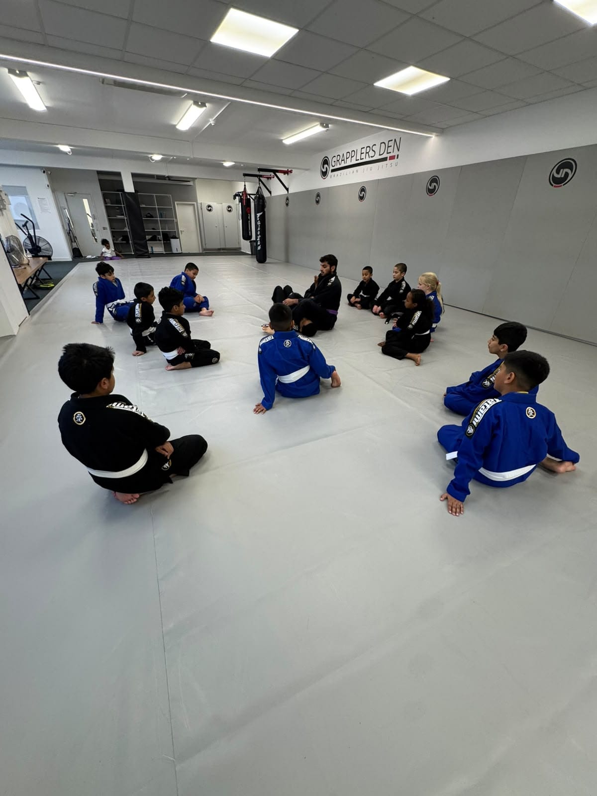 Javed coaching a kids' class at Grapplers Den